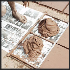 The making of Saltillo tile: clay is checked for thickeness evenness